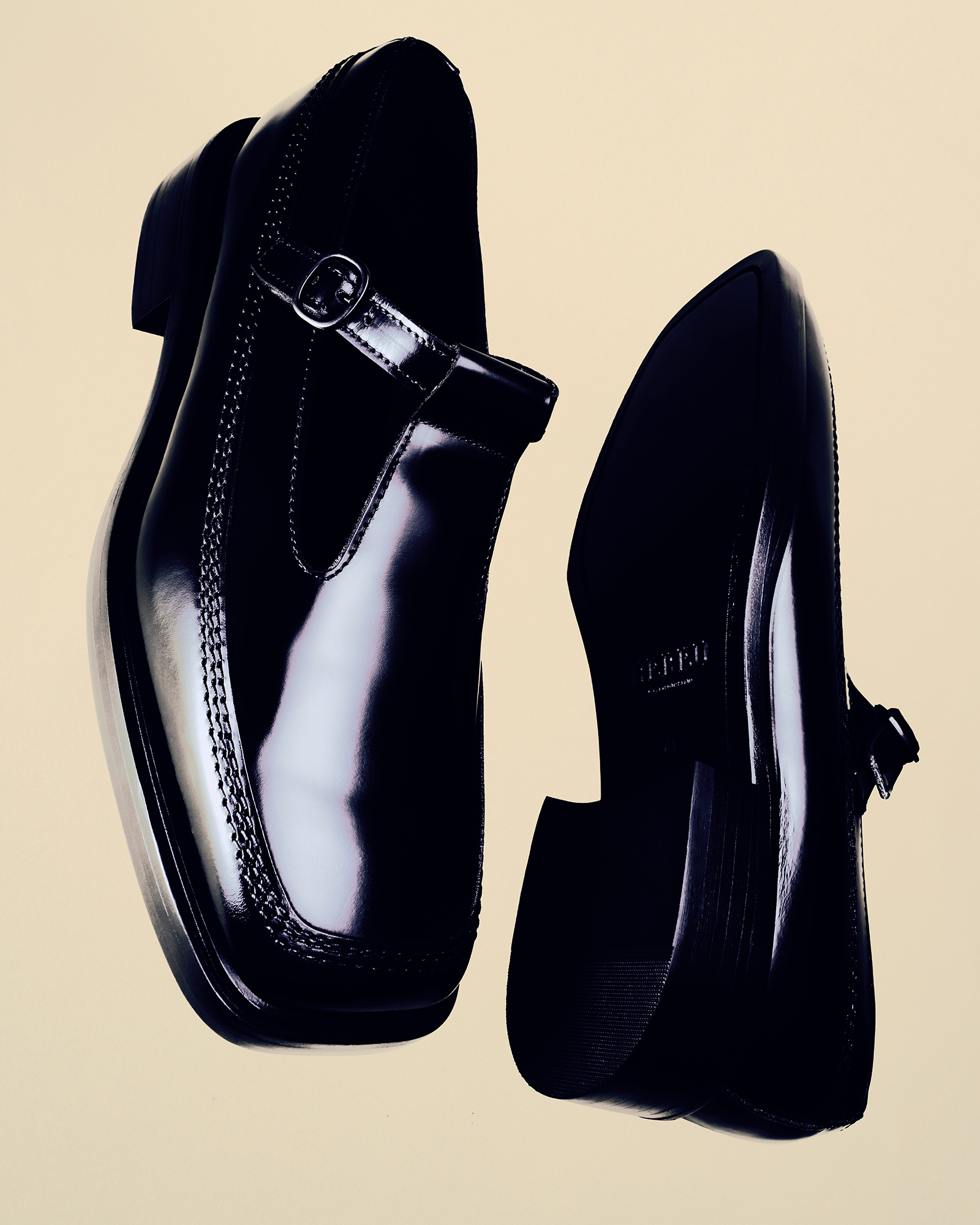 Hereu summer sandals on a soft beige wool background in natural light. 